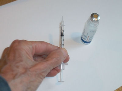 Draw air into syringe